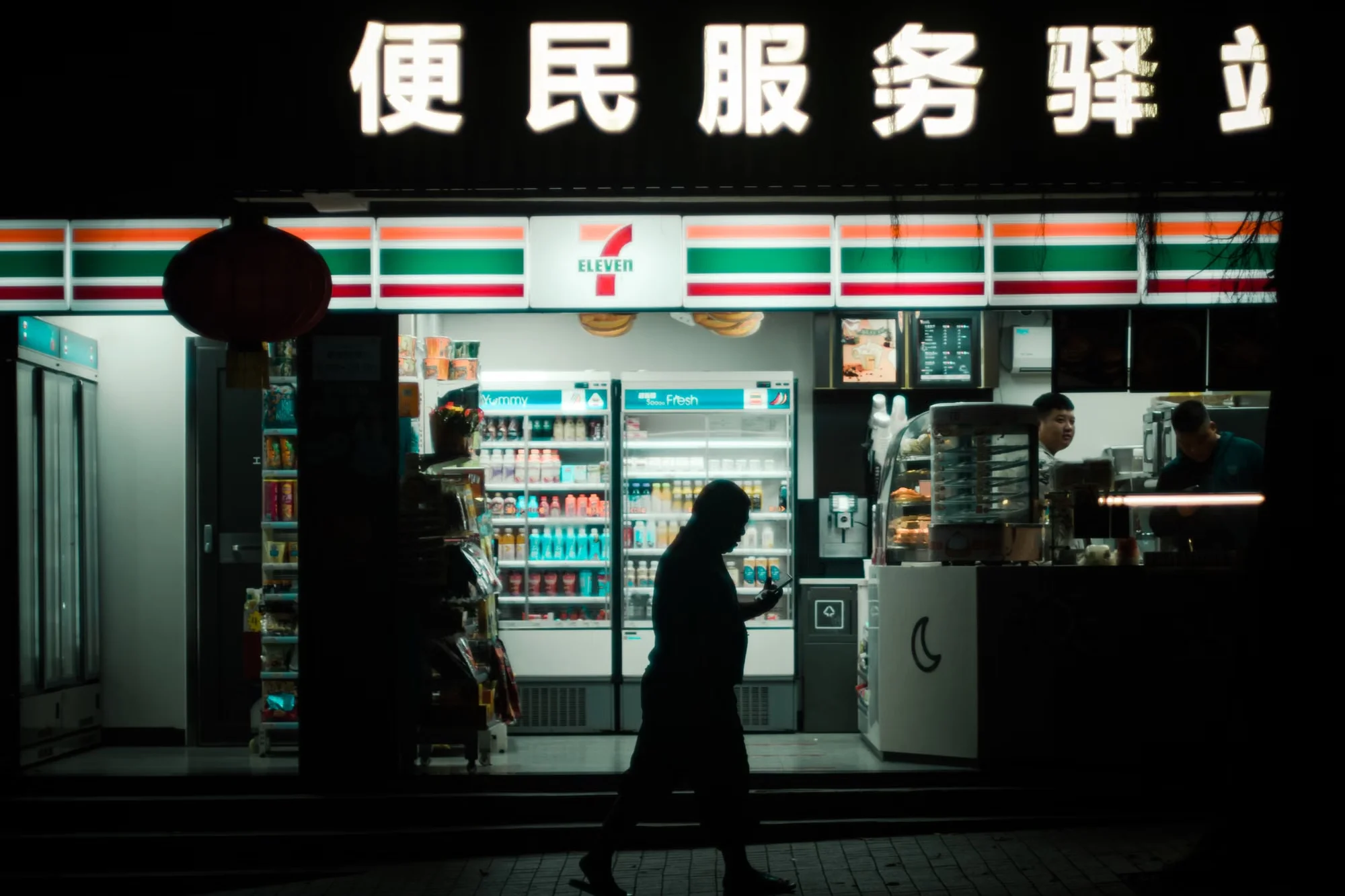 A convenience store counter in China where a contactless phone payment is being refunded on screen