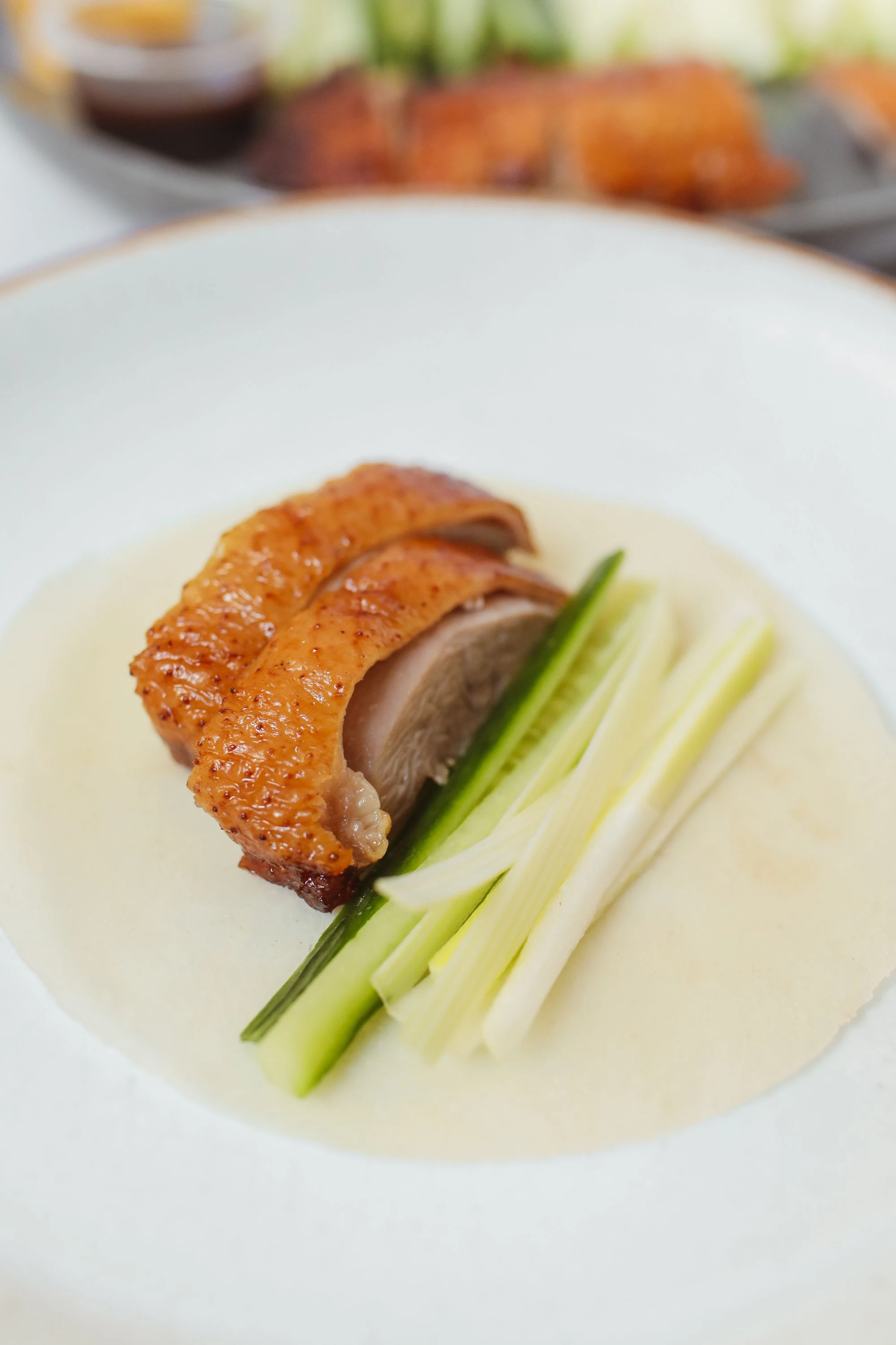 Peking duck served with pancakes, cucumber and scallion