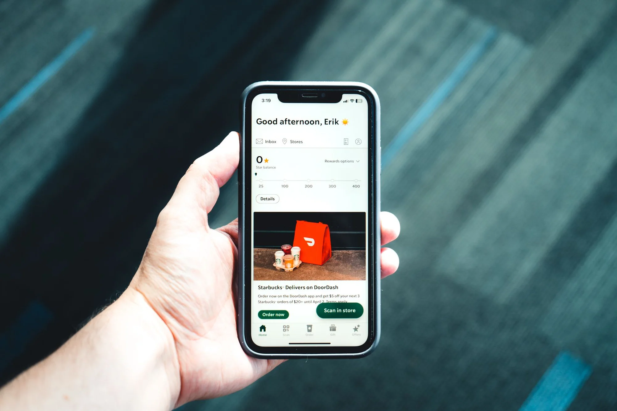 A smartphone showing a food and coffee shop app order screen