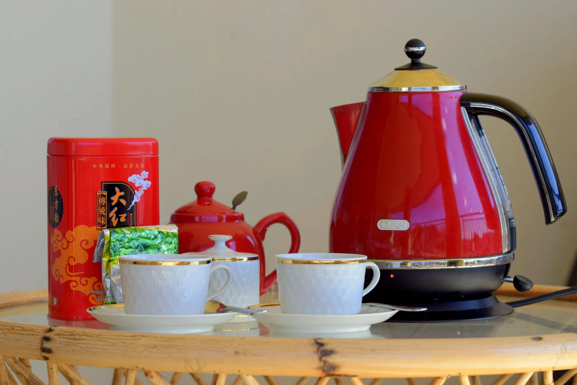 An electric kettle and a cup of hot tea on a hotel table in China