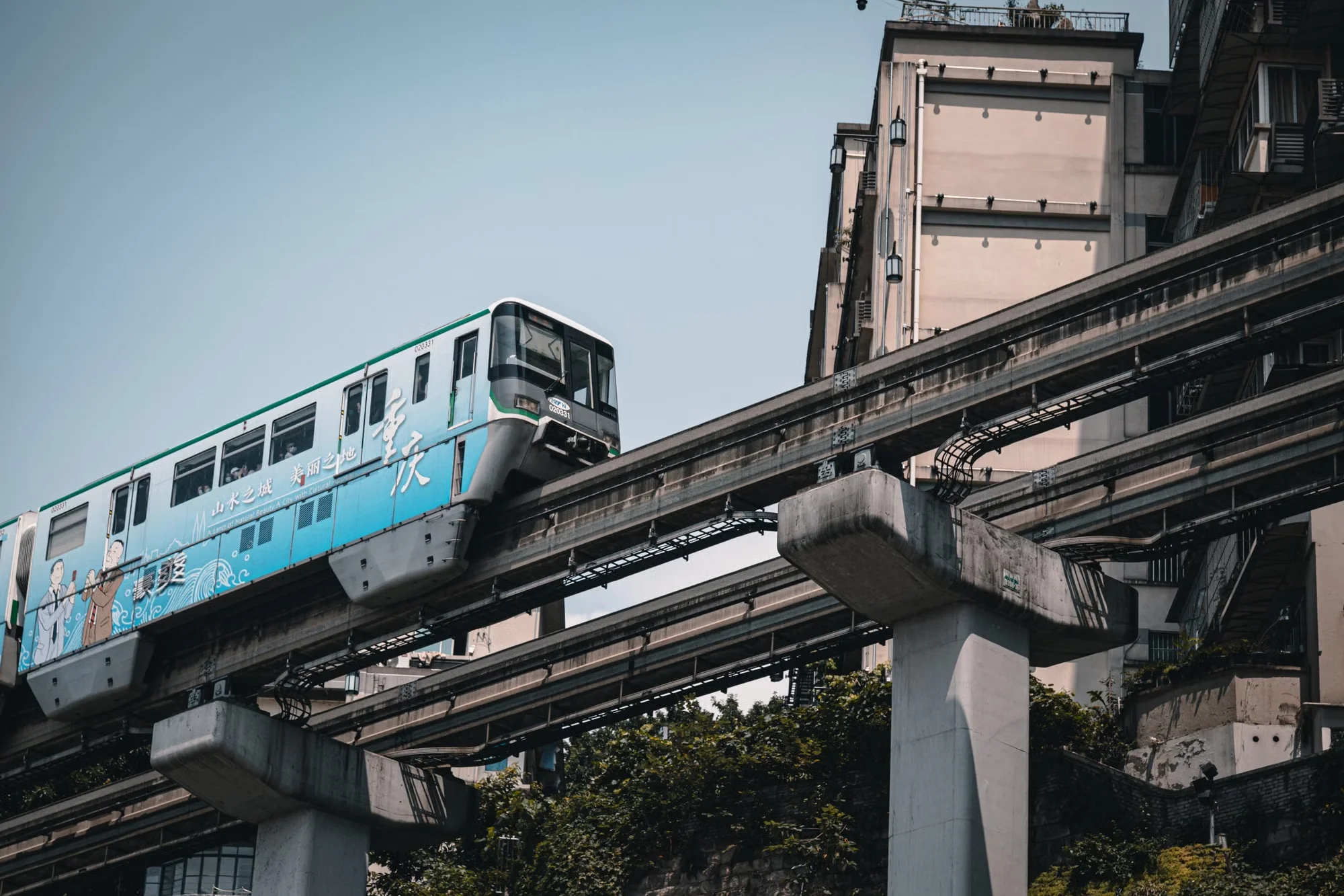 A Chinese city monorail train on elevated tracks in Chongqing