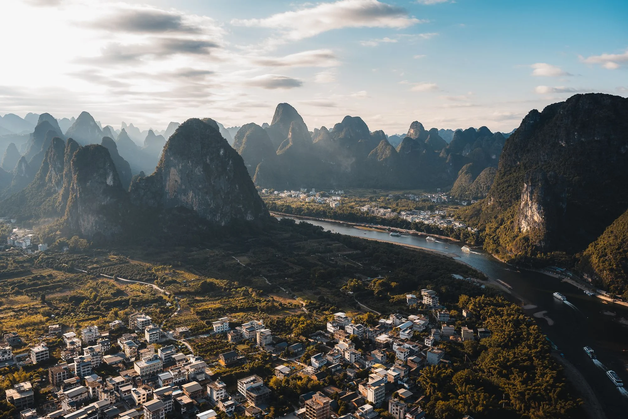 The Li River winding between Guilin's karst peaks at dawn mist