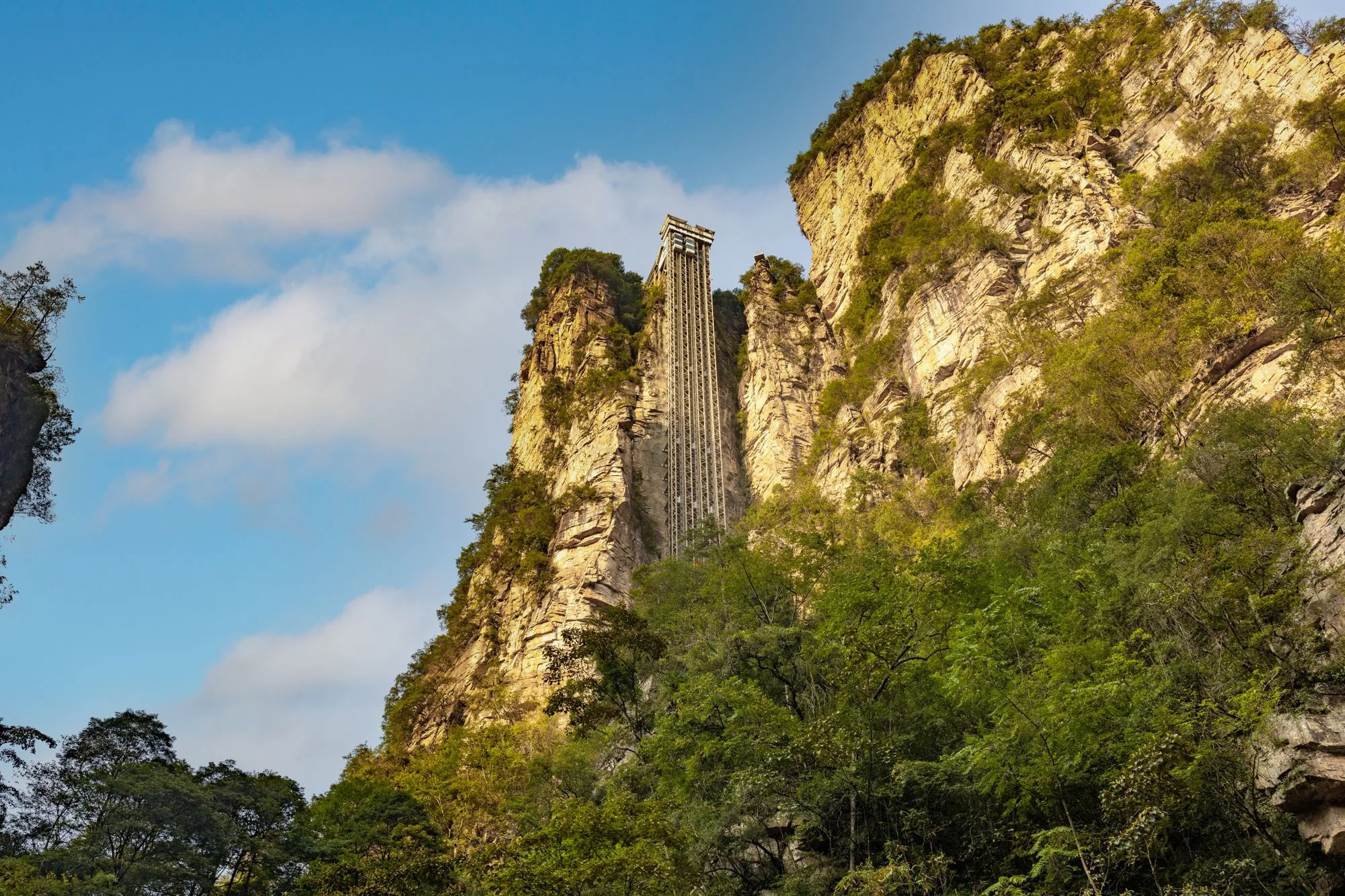 The Bailong Elevator built into a sheer sandstone cliff in Zhangjiajie National Forest Park, Hunan, China