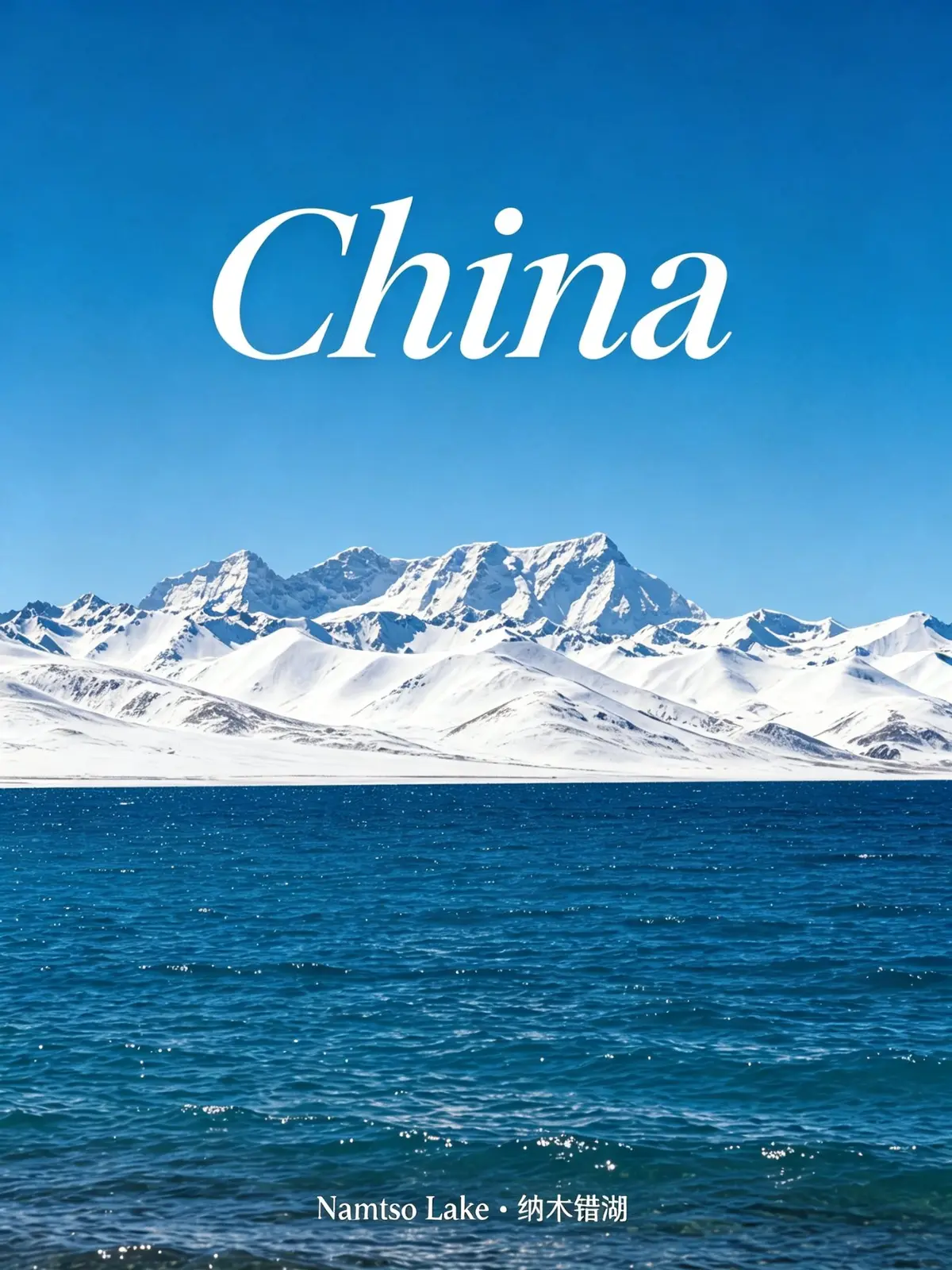 Snow-capped mountains behind the deep blue water of Namtso Lake under a clear sky.